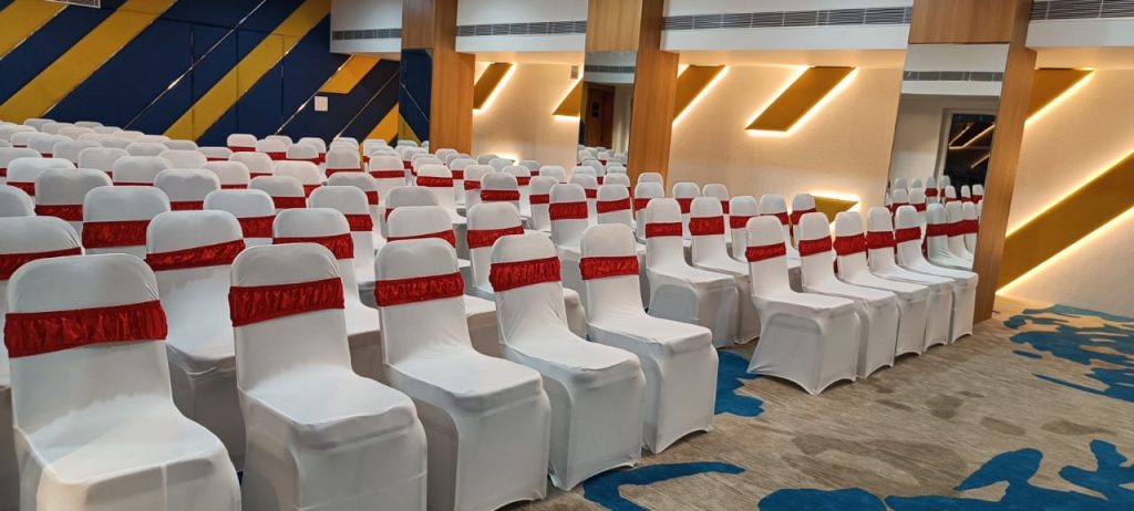 Spacious event venue with stage and decorations